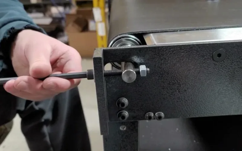 adjust conveyor belt tension